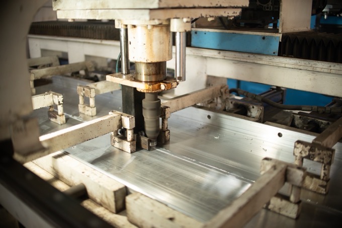 A CNC router machining an aluminium formwork panel